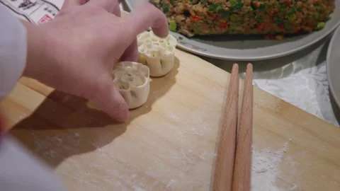 Multi lens shooting of the chef's hand process of making dumplings. Video stock 256131019
