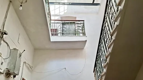 Multi Level Atrium with Railings, Window Light, and Vertical Shadows Stock Footage 331701956