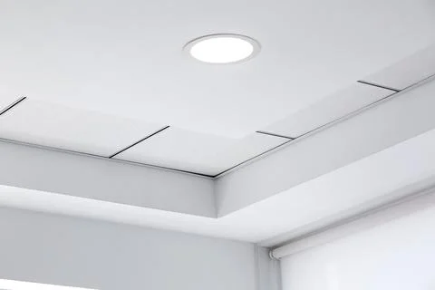 Multi-level ceiling with three-dimensional protrusions and suspended tiled. Stock Photos