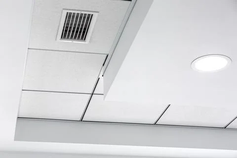 Multi-level ceiling with three-dimensional protrusions and suspended tiled. Stock Photos