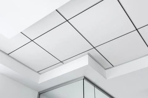 Multi-level ceiling with three-dimensional protrusions and suspended tiled. Stock Photos