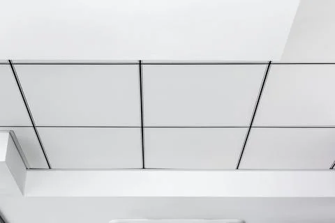 Multi-level ceiling with three-dimensional protrusions and suspended tiled. Stock Photos