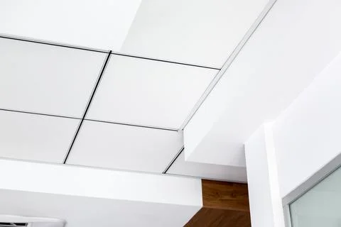 Multi-level ceiling with three-dimensional protrusions and suspended tiled. Stock Photos