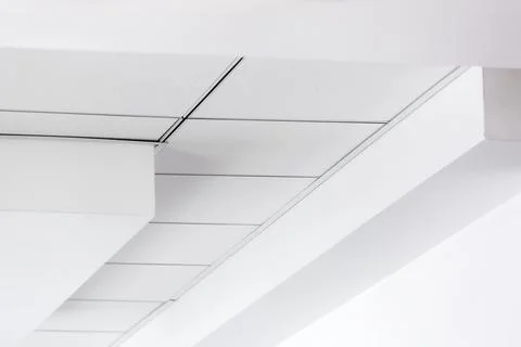 Multi-level ceiling with three-dimensional protrusions and suspended tiled. Stock Photos