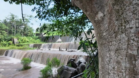 Multi-level dam on a river whose water is murky 스톡 동영상 291658670