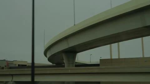 Multi-Level Highway Interchange with Suspension Bridge Elements Captured from Stock Footage 303909847