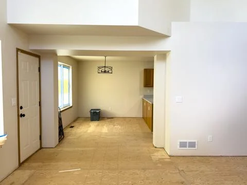 Multi-Level Home Interior Under Renovation with Staircase and Prepped Walls Stock Photos