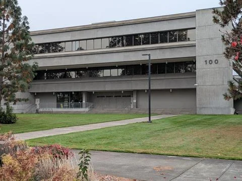 The multi-level Jackson County Justice Building rises in gray glass and concrete Stock Photos