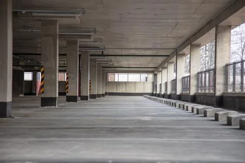 Multi-level parking with bright markings in the daytime with empty parking sp Stock Photos