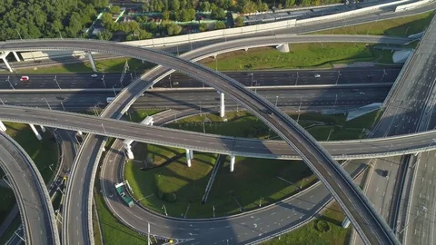 Multi-level road junction and cars traffic. Drone is flying to the right. Stock Footage