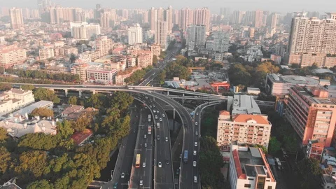 Multi-level road junction on high-speed highway traffic. Drone goes down Stock Footage 101863371