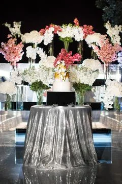Multi level wedding cake with flowers on the silver table Stock Photos