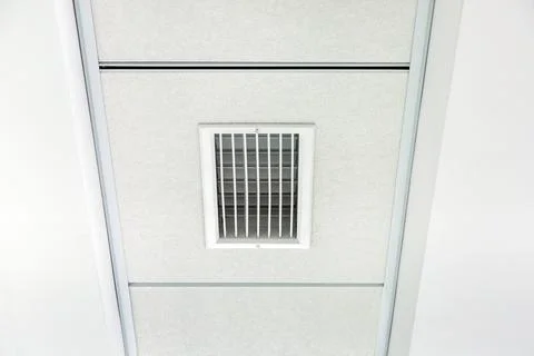 Multi level white plasterboard ceiling and square tiled suspended ceiling. Stock Photos