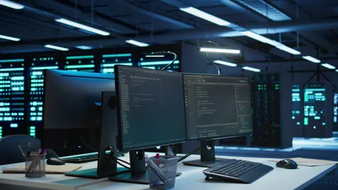 Multi monitor computer setup in data center used for monitoring security threats Stock Footage 280805301