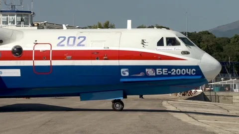 Multi-purpose amphibious aircraft Be-200ES slowly moves towards sea. Video stock 120804040