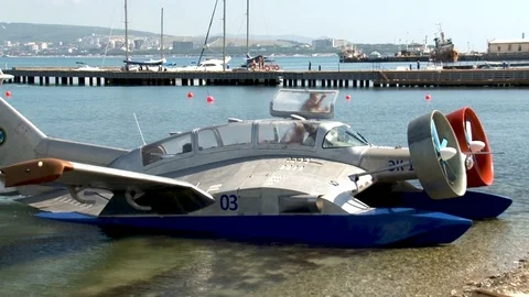 Multi-purpose ekranoplan Oriole with two huge rotating screws stops near shore. Stock Footage 121497262