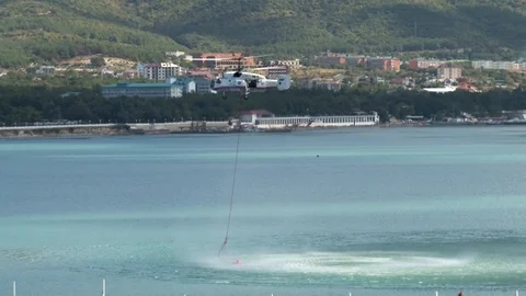 Multi-purpose helicopter Ka-32  hovering over waters of Gelendzhik Bay. Stock Footage 125304550