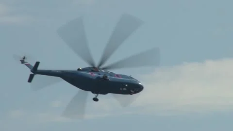 Multi-purpose helicopter Mi-38 performs flight with elements of aerobatics. Stock Footage 219809658