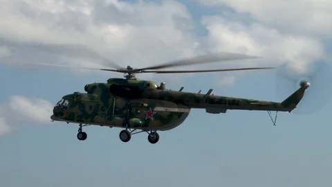 Multi-purpose helicopter Mi-8MTV (NATO: Hip) flies over runway for landing. Stock Footage 123210141