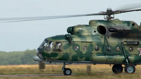 Multi-purpose helicopter Mi-8MTV (NATO: Hip) moves along taxiway. Close-up. Stock Footage 123409326