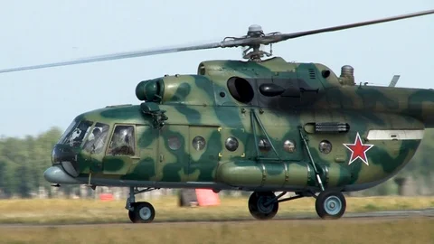 Multi-purpose military helicopter Mi-8MTV (NATO: Hip) moves along taxiway. Video stock 123329201
