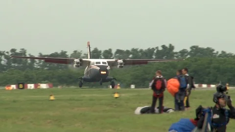Multi-purpose twin-engine Let L-410 Turbolet lands on runway of airfield. Stock Footage 106111821