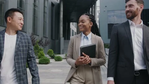 Multi-race handsome three colleagues walking home together. Diverse office Stock Footage 143549611