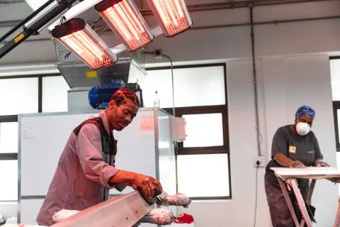 Multi races mechanics drying car pieces 写真素材