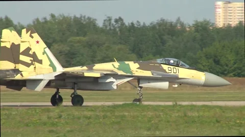 Multi-role super-maneuverable fighter Su-35 (Flanker-E) moves along runway. Stock Footage 198154091