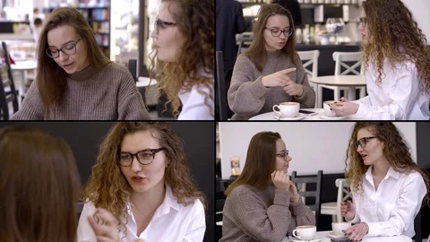 Multi-shot close-up of two beautiful girls friends who sit in a cafe and Stock Footage 129967826