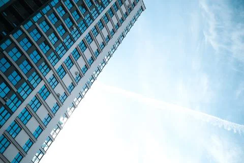 Multi-storey building on the background of blue sky Stock Photos