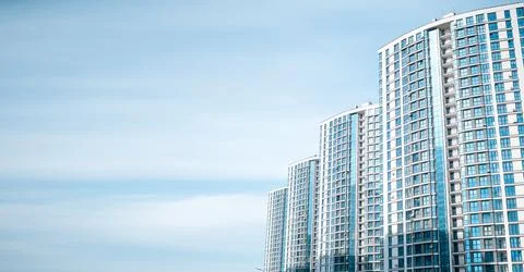 Multi-storey building on the background of blue sky Stock Photos