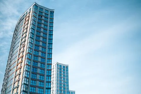 Multi-storey building on the background of blue sky Stock Photos