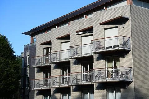 Multi-storey building with balconies located on several levels, the buildin.. Stock Photos