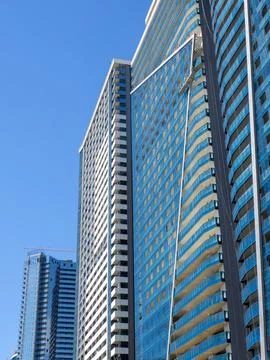 Multi-storey building concept. Background from the windows of the house. Ho.. Stock Photos