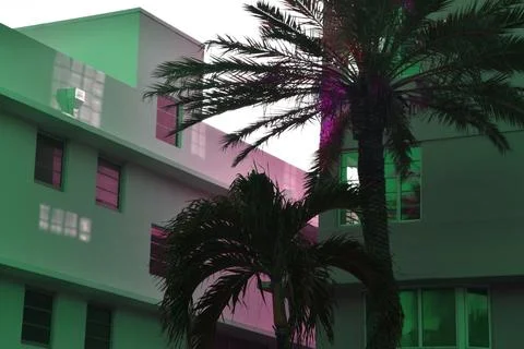  a multi-storey building with palm trees Stock Photos