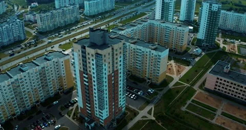 Multi-storey building in a residential area. Helicopter flight around the Stock Footage 138407741