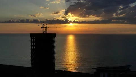 Multi-storey building under construction at sunset, aerial view Stock Footage 152374435