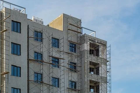 Multi-storey building under construction, erection of interior partitions fro Stock Photos