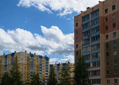 Multi-storey buildings on the background of clouds and sky Foto stock