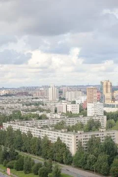 Multi-storey buildings top view of residential urban area with green parks. St Stock Photos