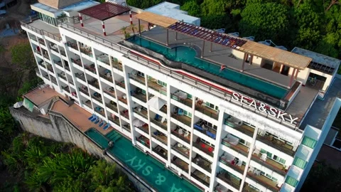 Multi-storey condominium with a hall and two swimming pools a terrace sunbeds Stock Footage 247251625