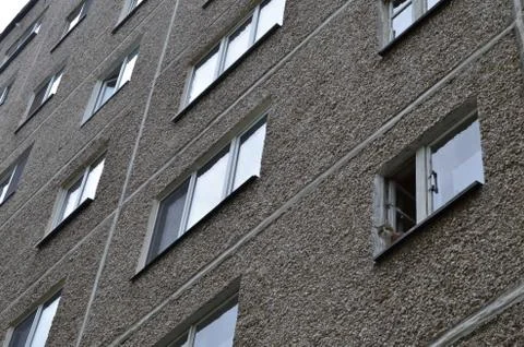 Multi-storey house with a cat in the window Stock Photos