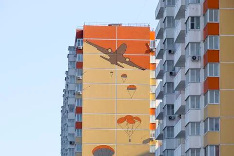 A multi-storey house with a painted wall. Figure depicting the landing of par Stock Photos