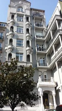 A multi-storey house with a round small balcony Stock Photos
