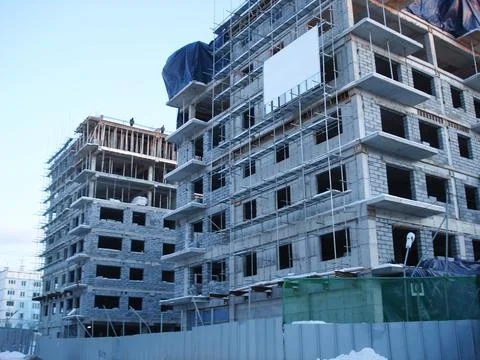 A multi-storey house under construction in winter. Stock Photos