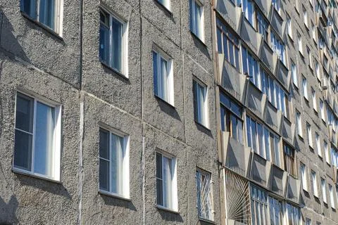 Multi-storey house,part of a multi-storey building, many Windows in the form of Stock Photos