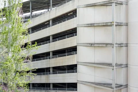 Multi storey parking garage facade near airport transport area Stock Photos
