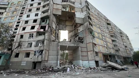 A multi-storey residential building was destroyed by an aerial bomb strike Stock Footage 285828256