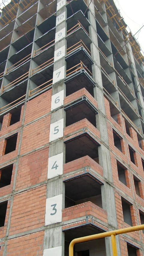Multi-Story Brick Building Under Construction with Floor Numbers Stock Footage 301531343